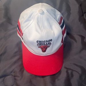 Chicago Bulls three striped truckers cap with adjustable strap.